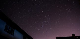 Starry evening seen over the top of houses